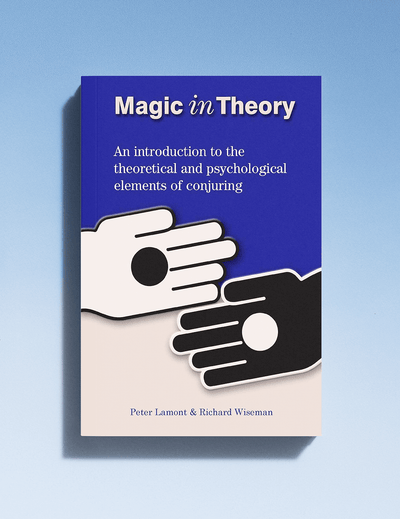 Book cover of 'Magic in Theory' with two hands reaching towards each other on a blue background