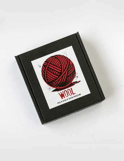 Black box with a red yarn ball design and 'WOOL' text on a white background
